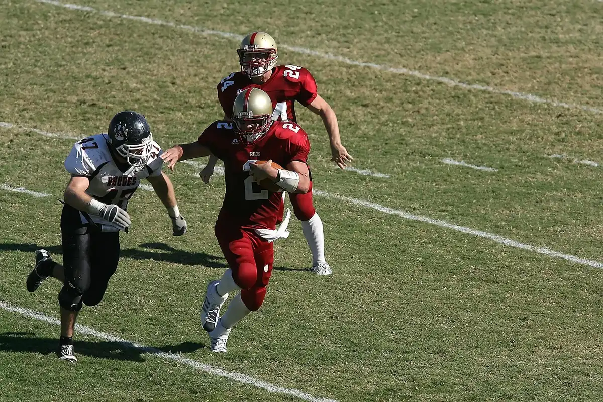 Quarterback preparing to throw during a college game