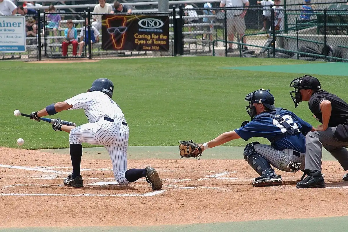 Batter in batting practice focusing on swing mechanics
