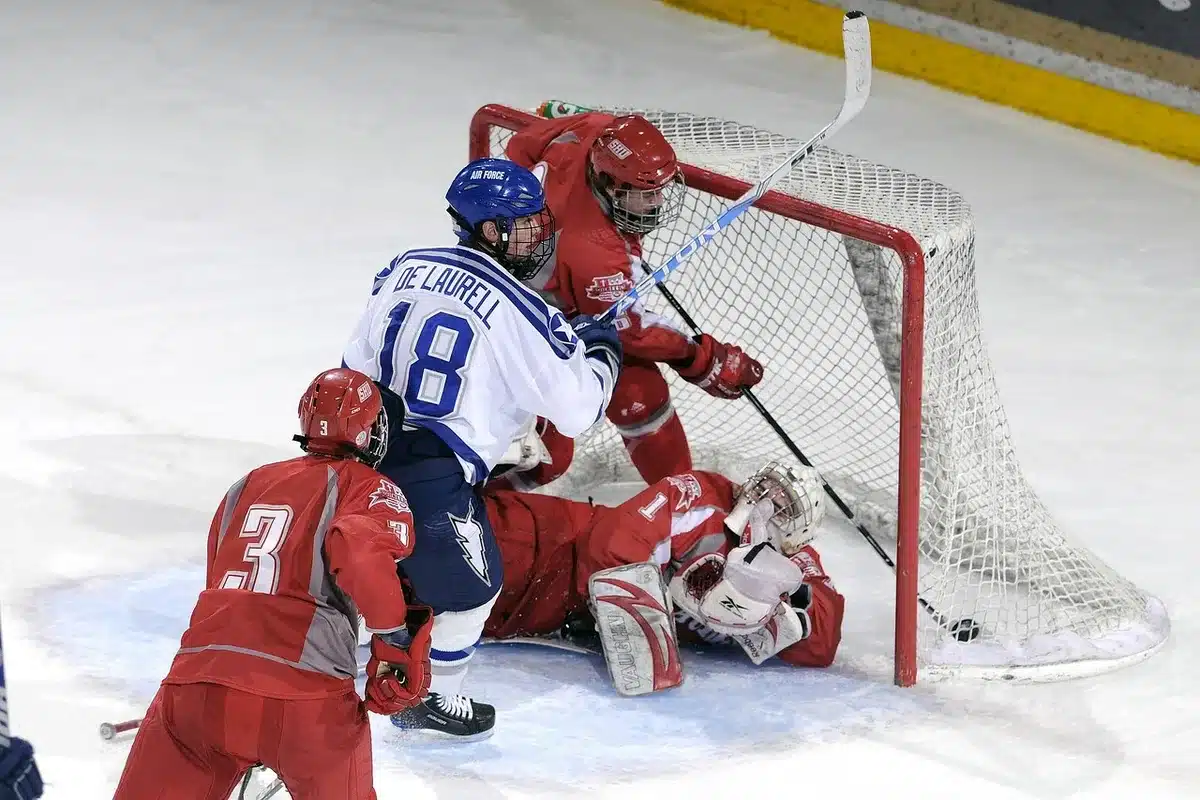 College goaltender practicing in front of the net