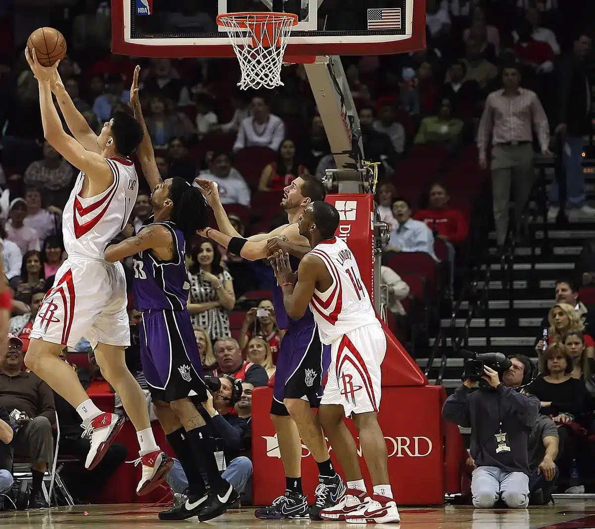 Player making a precise kick-out pass on a spaced basketball court