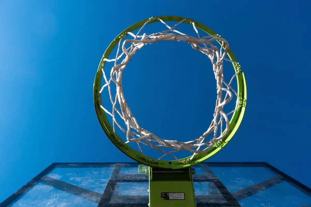 Center grabbing a rebound and defending the rim during practice