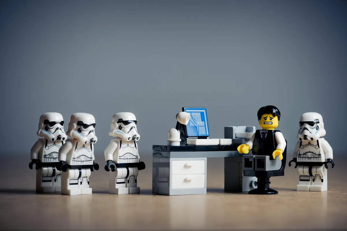 Executives discussing sports branding and commercial strategy in an office